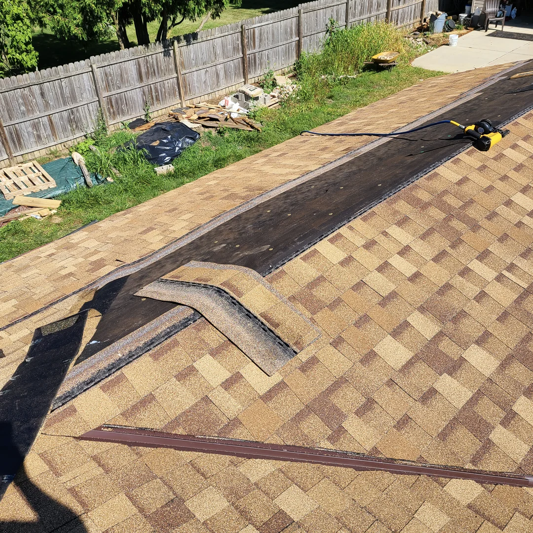 New architectural asphalt shingles being installed on a roof