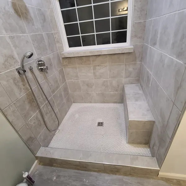 Walk-in tile shower with built-in bench