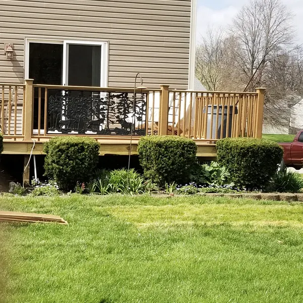 Backyard deck with decorative metal railing panels