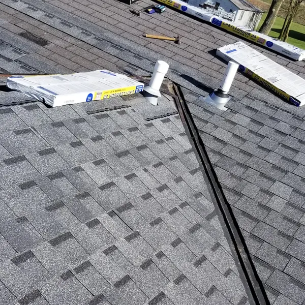 New asphalt shingle roof with replacement roof vents