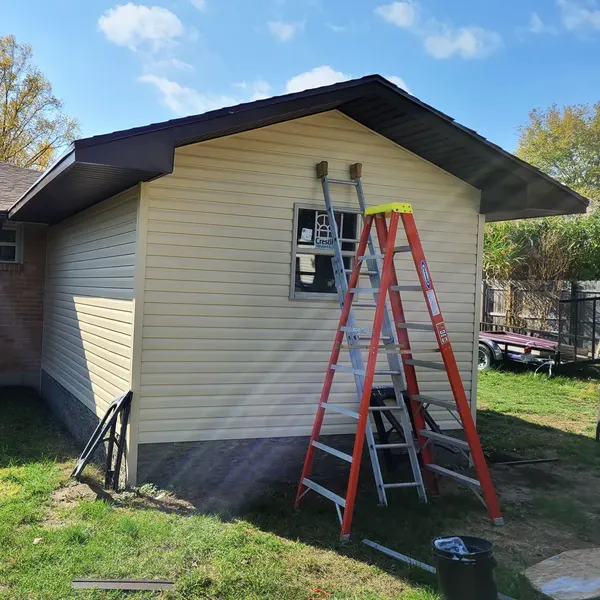 Backyard shed with new vinyl siding and trim